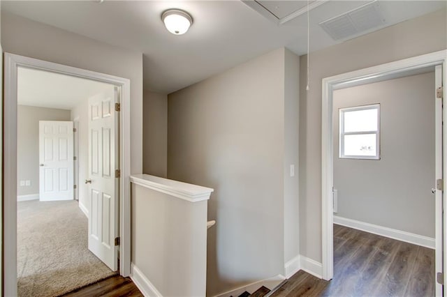 hall with dark wood-type flooring