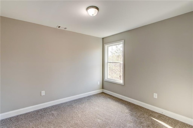 unfurnished room featuring carpet flooring