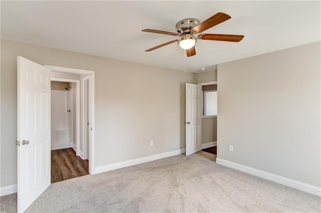 unfurnished bedroom featuring ceiling fan and carpet floors