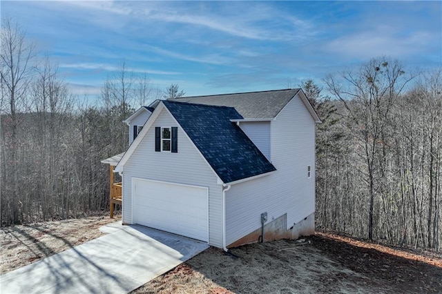 view of side of property featuring a garage