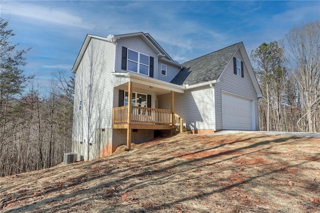 front of property with cooling unit and covered porch