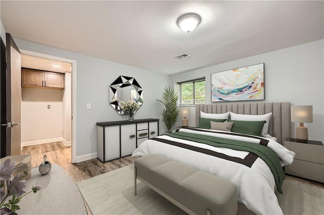 3046 Briarcliff Rd NE Unit 15, Atlanta, GA 30329 - bedroom with light wood-type flooring and baseboards