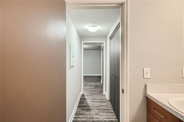 3046 Briarcliff Rd NE Unit 15, Atlanta, GA 30329 - hallway with dark wood-style floors, baseboards, and a sink