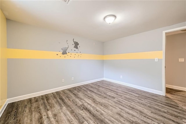 3046 Briarcliff Rd NE Unit 15, Atlanta, GA 30329 - spare room with wood finished floors and baseboards