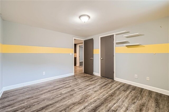 3046 Briarcliff Rd NE Unit 15, Atlanta, GA 30329 - empty room with wood finished floors and baseboards
