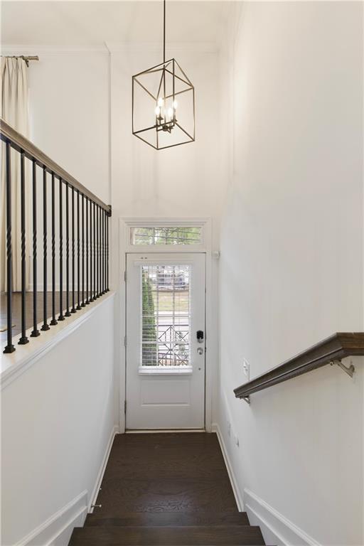 1962 Bainbridge Ln, Chamblee, GA 30345 - entryway featuring a chandelier, wood finished floors, and stairway