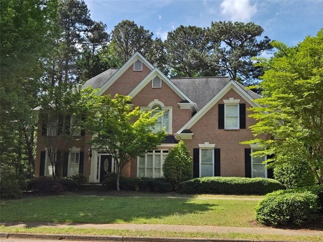 1000 Admiral Xing, Alpharetta, GA 30005 - view of front of house with brick siding and a front yard