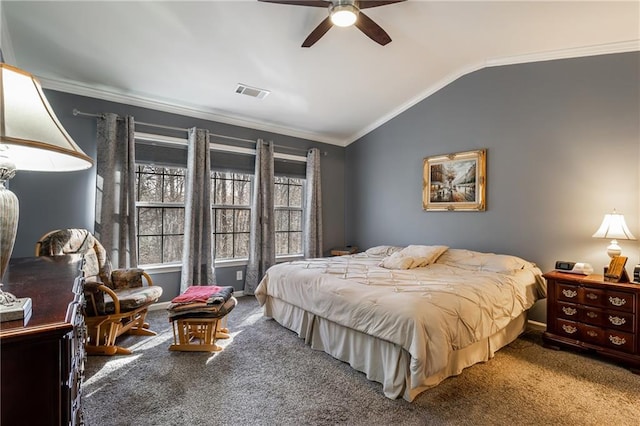 carpeted bedroom with ceiling fan, lofted ceiling, and ornamental molding