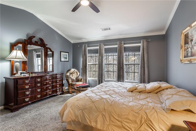 bedroom with carpet floors, vaulted ceiling, ceiling fan, and crown molding