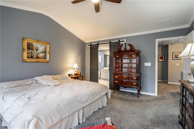 carpeted bedroom with lofted ceiling, ensuite bath, ceiling fan, a barn door, and ornamental molding