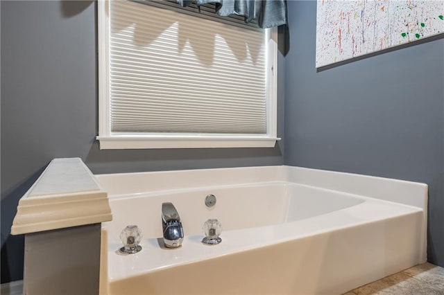 bathroom featuring a washtub