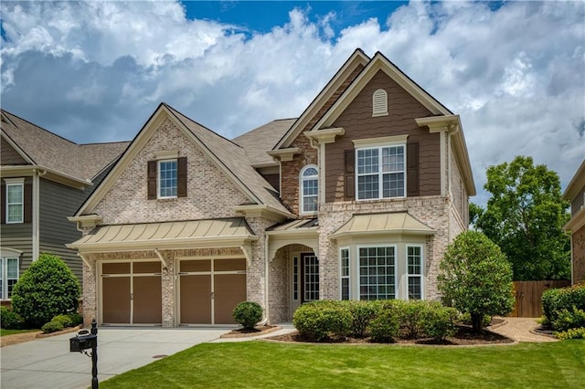 4652 Prater Way SE, Smyrna, GA 30080 - view of front of home featuring driveway, brick siding, and a standing seam roof