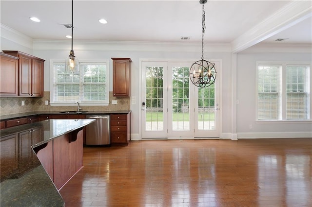 4652 Prater Way SE, Smyrna, GA 30080 - kitchen featuring stainless steel dishwasher, dark wood-style floors, a chandelier, decorative light fixtures, and tasteful backsplash