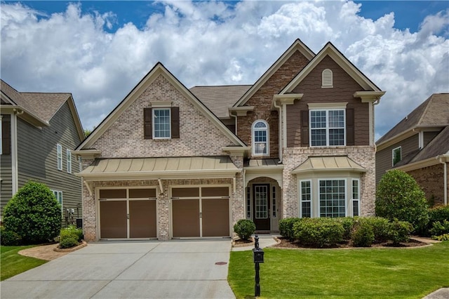 4652 Prater Way SE, Smyrna, GA 30080 - craftsman house featuring concrete driveway, a front yard, a standing seam roof, brick siding, and a garage
