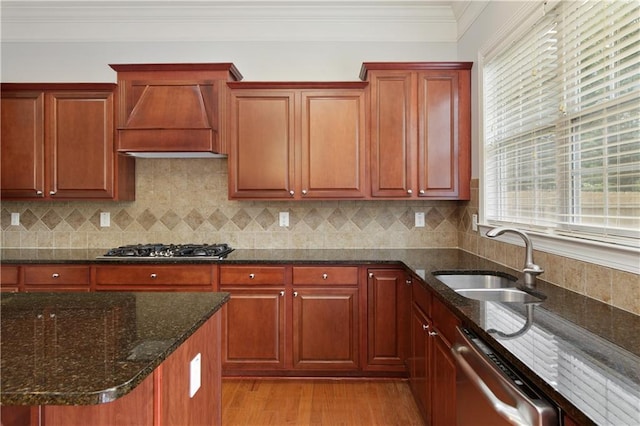 4652 Prater Way SE, Smyrna, GA 30080 - kitchen with premium range hood, stainless steel dishwasher, light wood-style floors, gas cooktop, and dark stone countertops