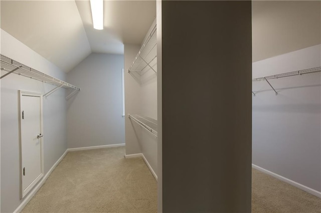 4652 Prater Way SE, Smyrna, GA 30080 - spacious closet featuring light carpet and lofted ceiling