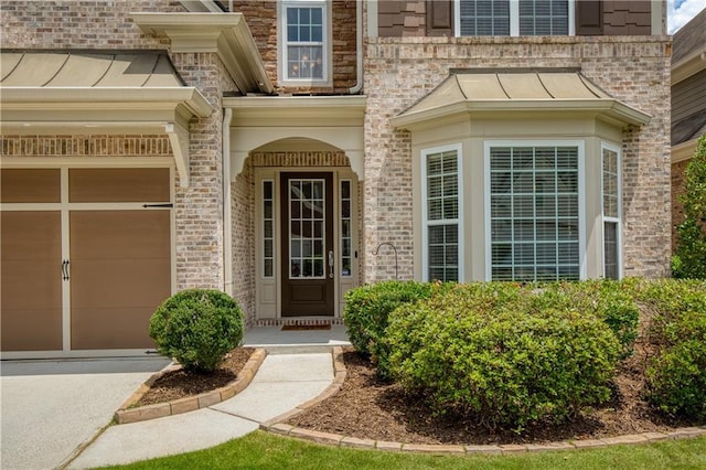 4652 Prater Way SE, Smyrna, GA 30080 - entrance to property with a standing seam roof, brick siding, driveway, and a metal roof
