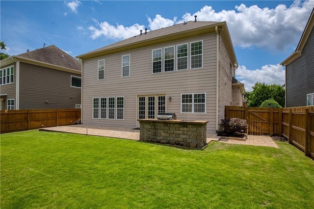 4652 Prater Way SE, Smyrna, GA 30080 - back of property featuring a patio area, a fenced backyard, and exterior kitchen
