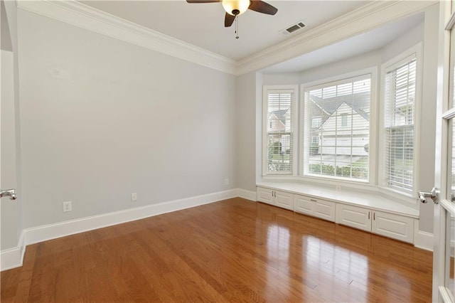 4652 Prater Way SE, Smyrna, GA 30080 - spare room featuring wood finished floors, a ceiling fan, and ornamental molding