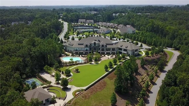 bird's eye view featuring a wooded view
