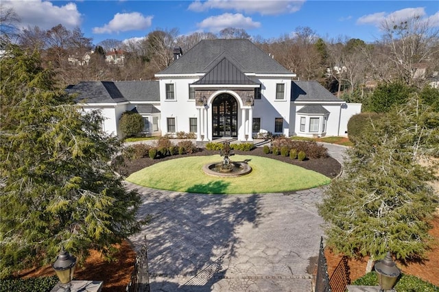 view of front of property with french doors and a front yard