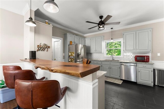 1536 Enota Ave, Gainesville, GA 30501 - kitchen featuring a wainscoted wall, a sink, ceiling fan with notable chandelier, and dishwasher