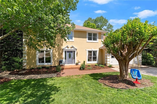 1536 Enota Ave, Gainesville, GA 30501 - colonial home with a garage, stucco siding, driveway, and a front yard