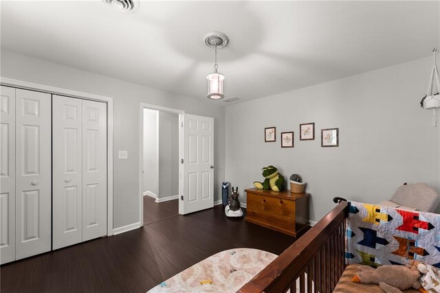 1536 Enota Ave, Gainesville, GA 30501 - bedroom featuring baseboards, a tray ceiling, visible vents, and wood finished floors