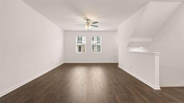 interior space with ceiling fan and dark hardwood / wood-style floors