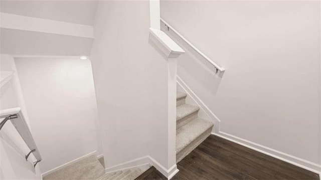 stairs with wood-type flooring