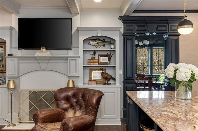 living area with ornamental molding and wood finished floors