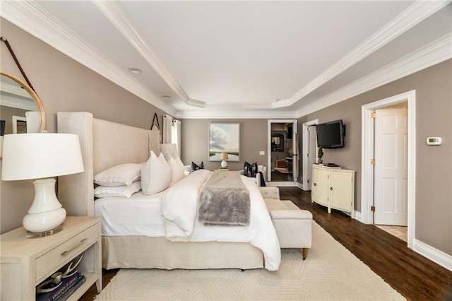 bedroom featuring baseboards, dark wood finished floors, and crown molding