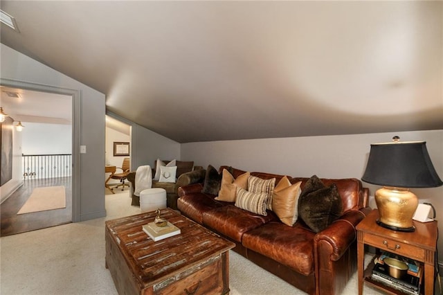 living area with carpet and lofted ceiling