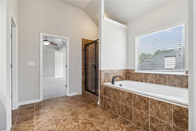 bathroom featuring tile patterned flooring, ceiling fan, separate shower and tub, and vaulted ceiling