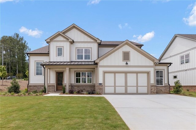 view of front of home featuring a garage and a front lawn