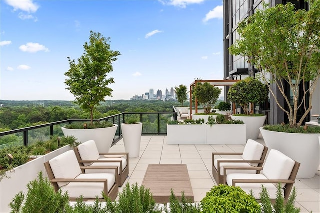 2425 Peachtree Rd NE Unit 1503, Atlanta, GA 30305 - view of patio featuring outdoor lounge area and a city view