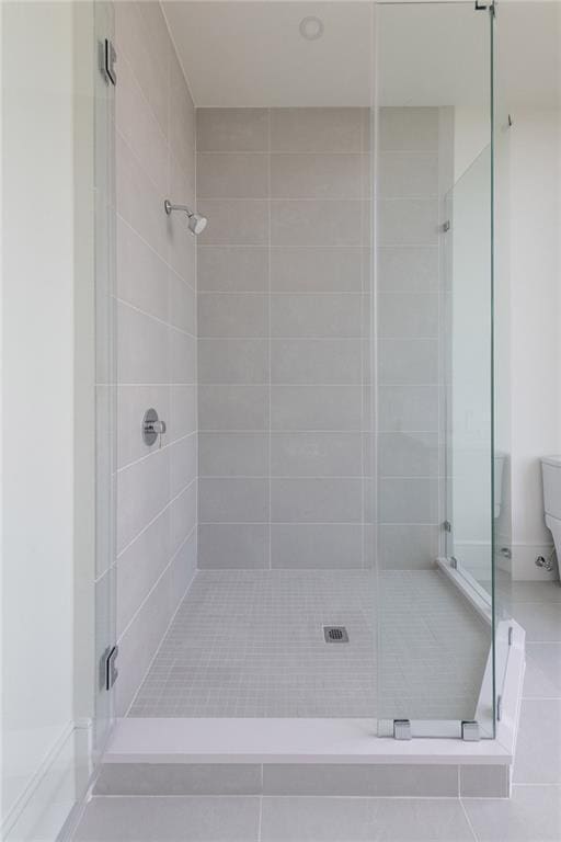 2425 Peachtree Rd NE Unit 1503, Atlanta, GA 30305 - full bath featuring a stall shower and tile patterned floors
