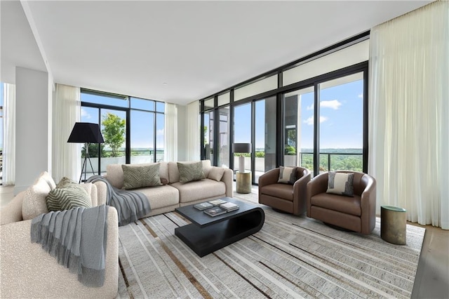 2425 Peachtree Rd NE Unit 1503, Atlanta, GA 30305 - living area featuring expansive windows, light wood-type flooring, and a water view