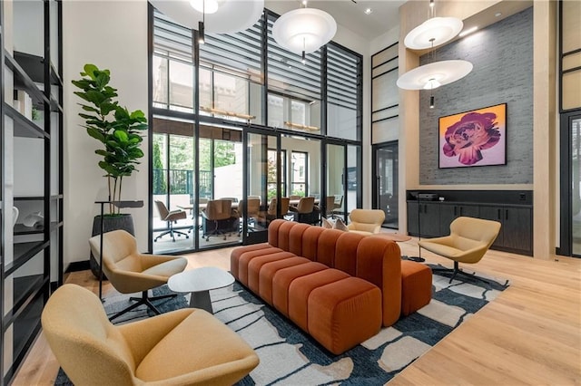 2425 Peachtree Rd NE Unit 1503, Atlanta, GA 30305 - building lobby featuring a towering ceiling and a wall of windows