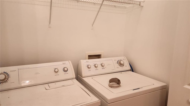 washroom featuring washing machine and dryer