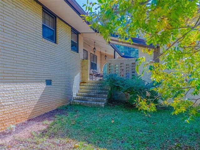 view of home's exterior featuring brick siding