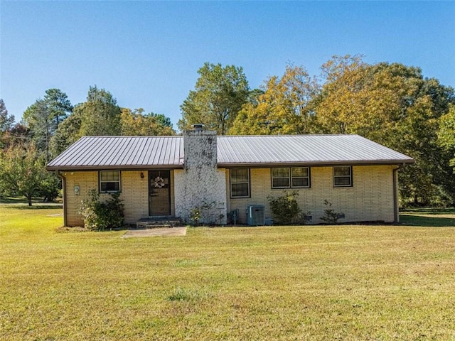 single story home with brick siding, crawl space, a chimney, and a front lawn