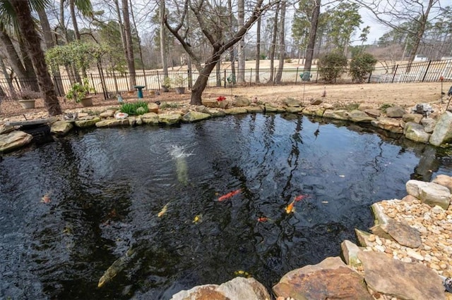 view of water feature with a fenced backyard