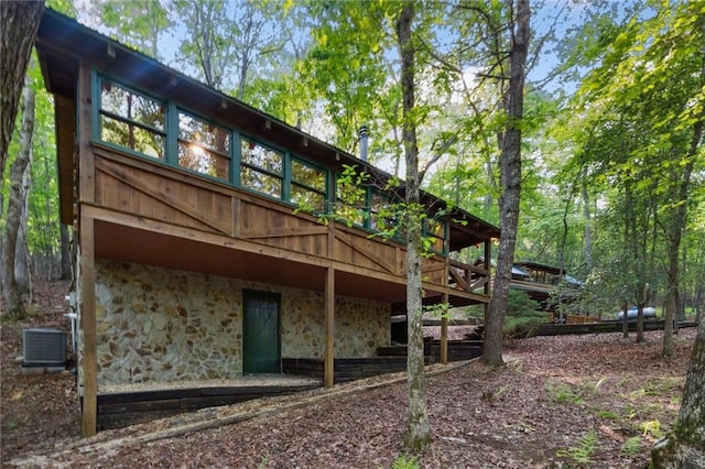 251 Honeysuckle Way, Blue Ridge, GA 30513 - rear view of property featuring stone siding, a deck, and central AC