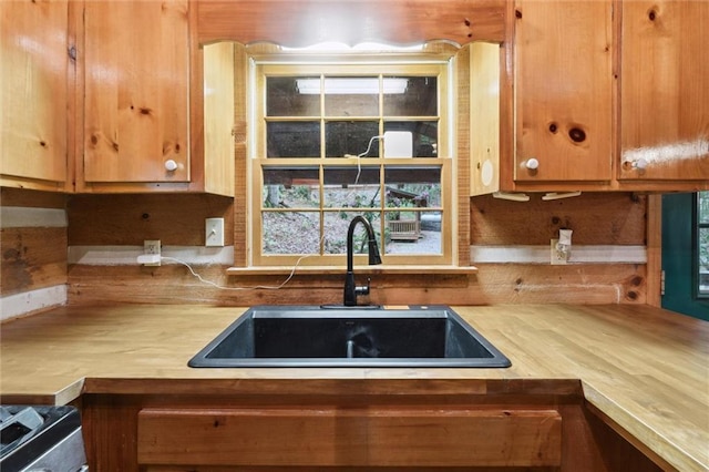 251 Honeysuckle Way, Blue Ridge, GA 30513 - kitchen with a sink, light countertops, and brown cabinets