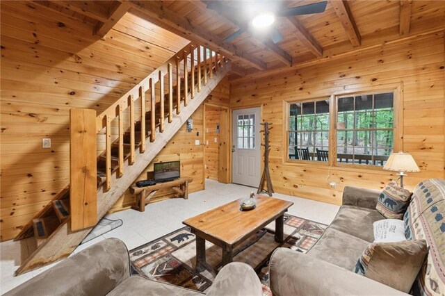 251 Honeysuckle Way, Blue Ridge, GA 30513 - living room with wood walls, wooden ceiling with exposed beams, a ceiling fan, stairs, and tile patterned floors