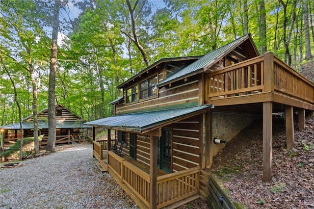 251 Honeysuckle Way, Blue Ridge, GA 30513 - rear view of property with a deck, metal roof, and view of scattered trees