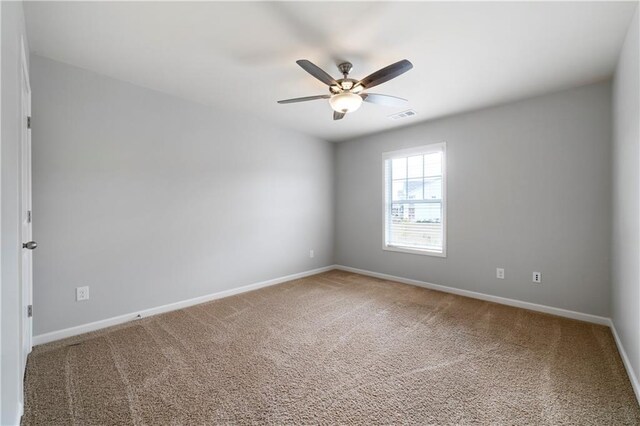 unfurnished room with carpet floors and ceiling fan