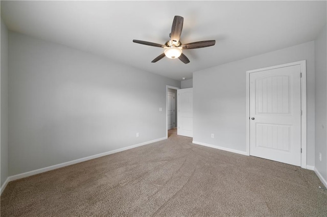 carpeted empty room with ceiling fan