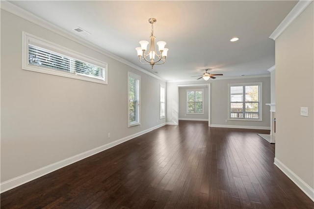 empty room featuring ceiling fan with notable chandelier, dark hardwood / wood-style flooring, and crown molding